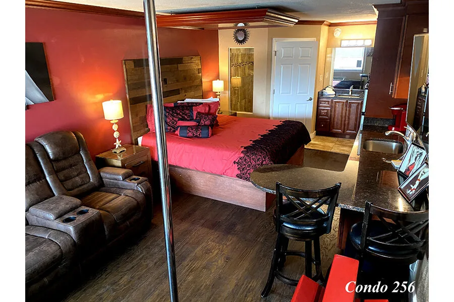 A king fantasy suite with a dance pole at Secrets Hideaway